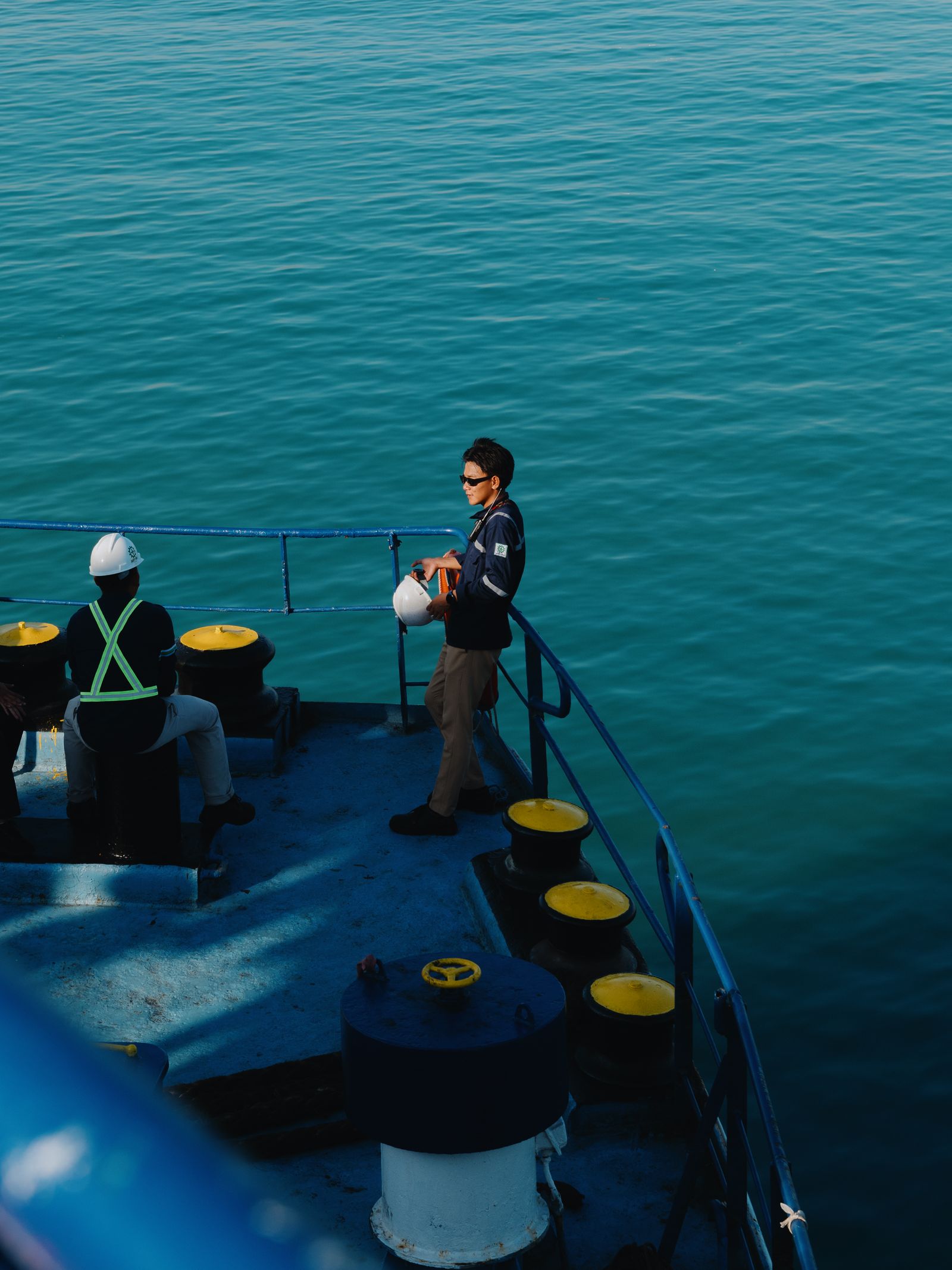 Maritime crew working together on a ship deck